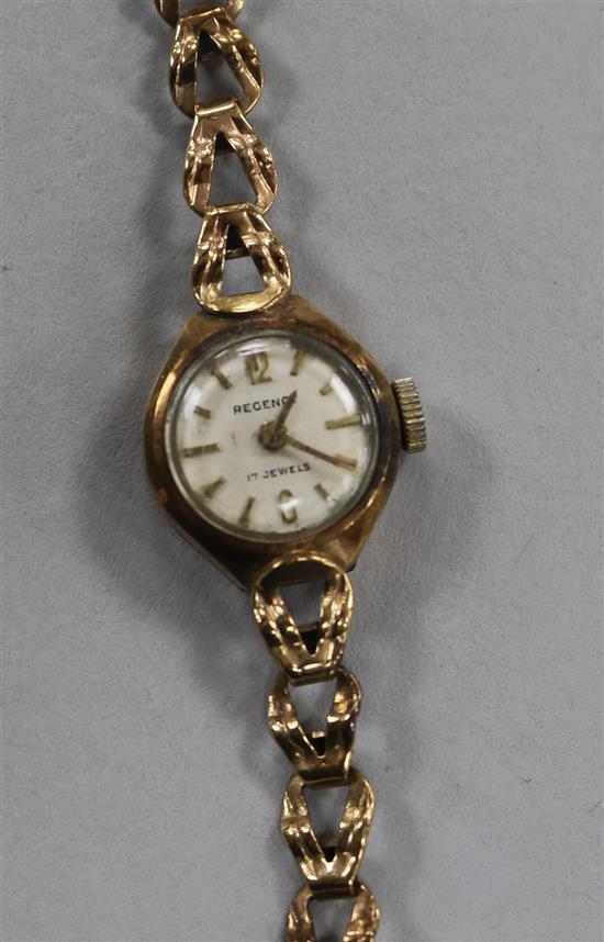 A ladys 9ct manual wind wrist watch on a 9ct gold bracelet.